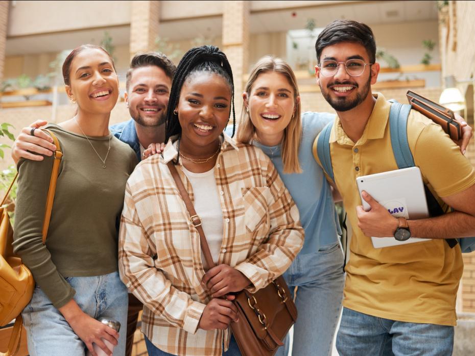 A group of international students smiling to camera