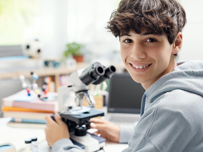 Teen boy in a science lab