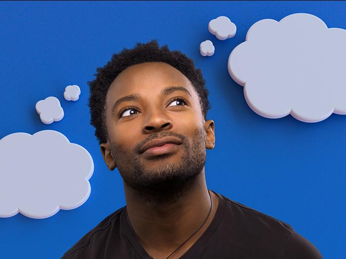 Young Black man with thought bubbles