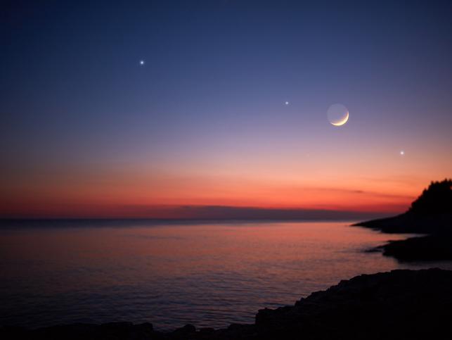 A moonlit sky with faraway stars