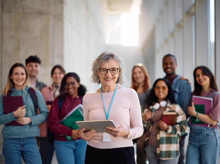 University staff smiling to camera