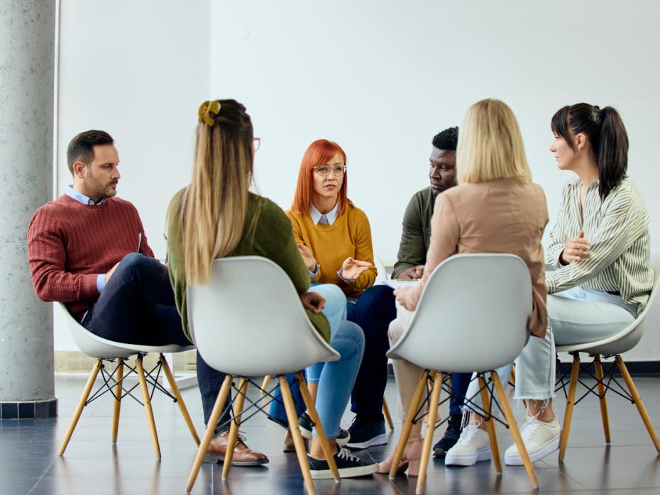 A group of research participants sitting in a circle