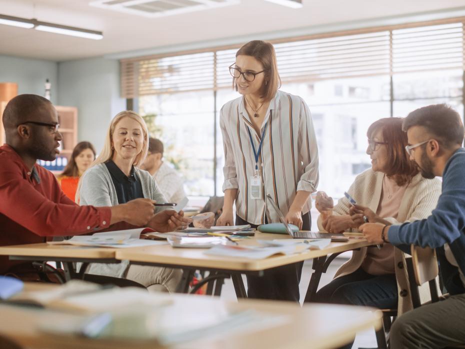 Female lecturer addresses a group of students