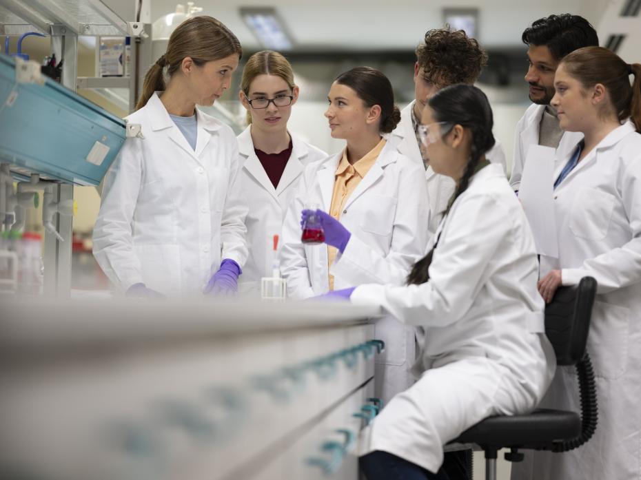 A group of students conducting an experiment in a lab