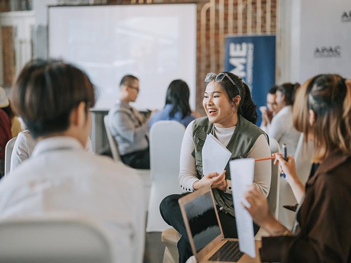 Asian students articipating in small-group discussion