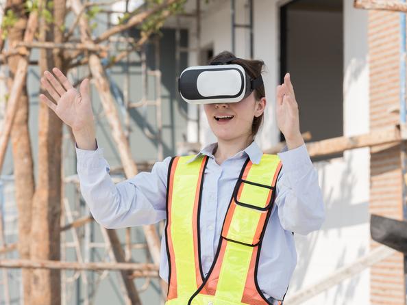 A construction student uses a VR headset