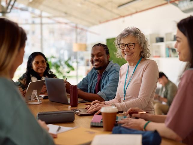 Academics and students talk together