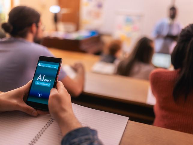 A student opens an AI chatbot in a lecture hall