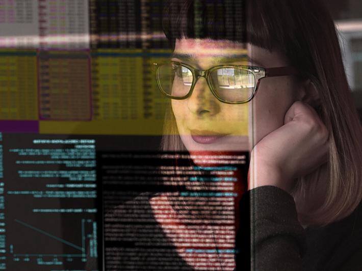 Female academic reading on a screen