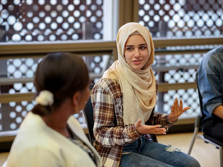 Muslim college-age female students in discussion