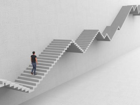 Man climbing up-and-down graph-like staircase