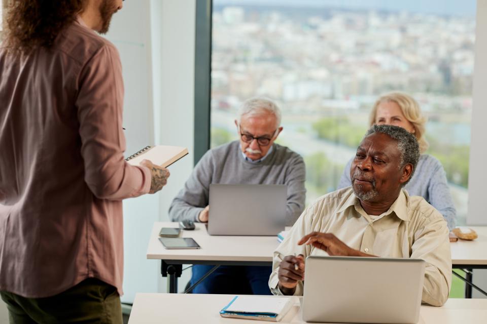 Older students at their desks at a university