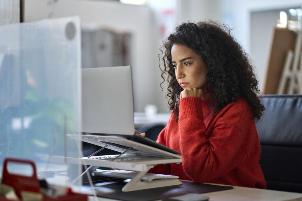 A female student working on her laptop 