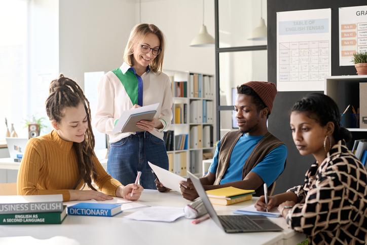 An educator talks to international students