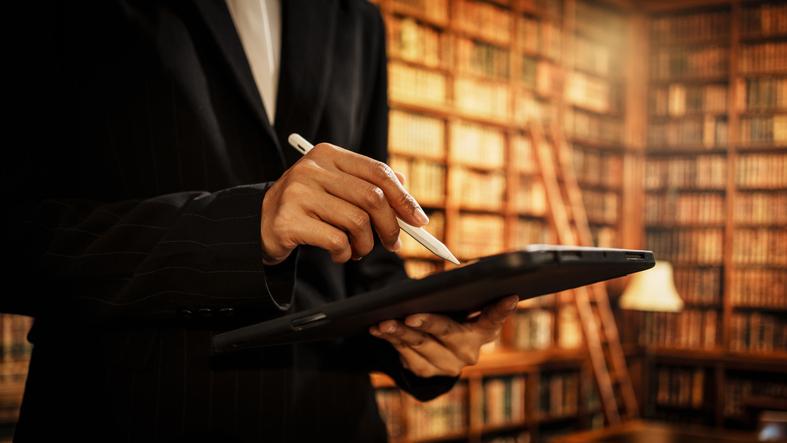 A librarian uses a tablet