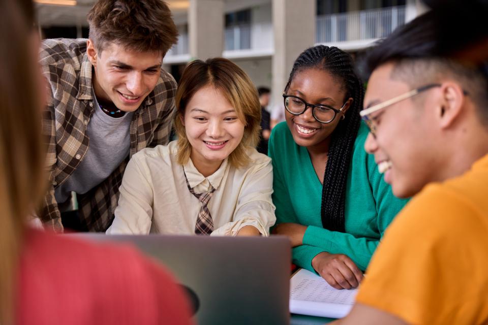 Five university students working on a group project in class
