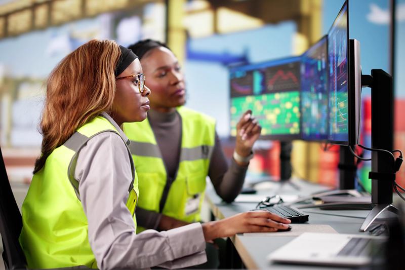 Young black woman and older woman working on logistics