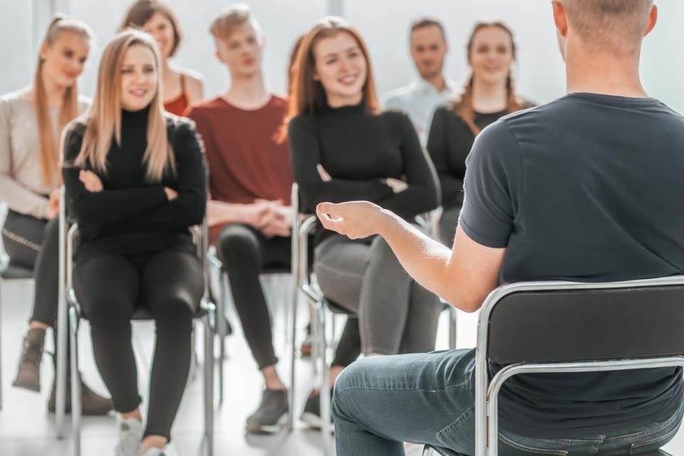 Male students presents to his classmates