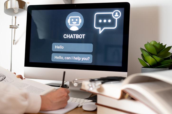 A doctor uses a chatbot on a desktop screen