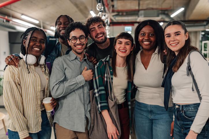 Students laugh in a group together