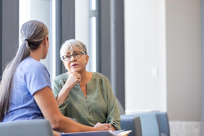 Health worker talks to a patient