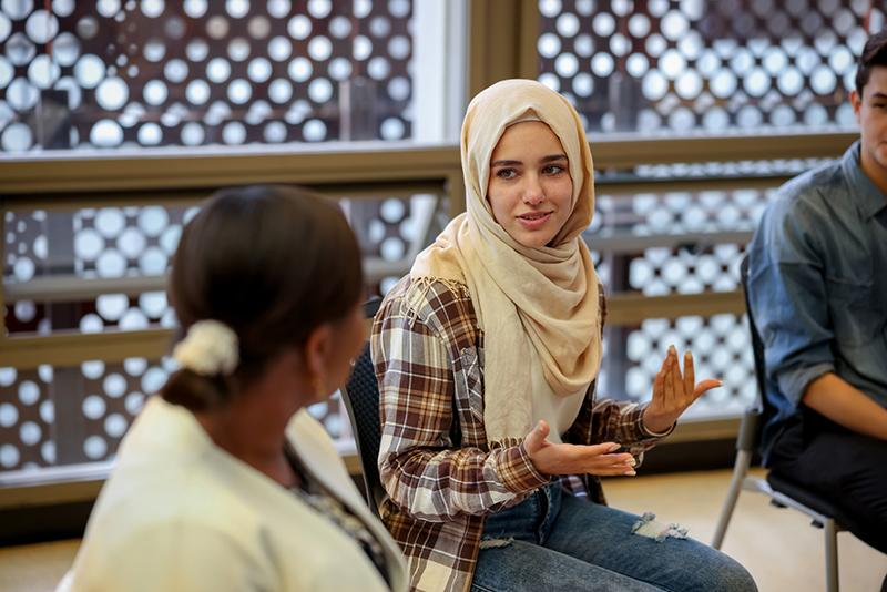 Muslim college-age female students in discussion