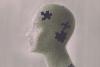 Illustration of head jigsaw puzzle with pieces missing