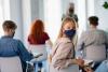 Students wearing a mask in class to protect against viral infection