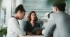 Researchers discuss ideas in a meeting